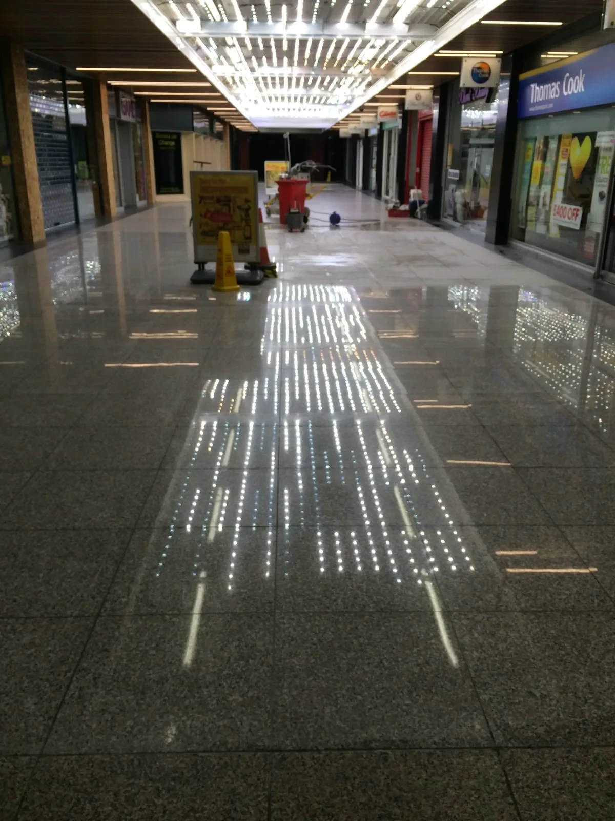 Granite shopping-centre walkway after mirror polishing