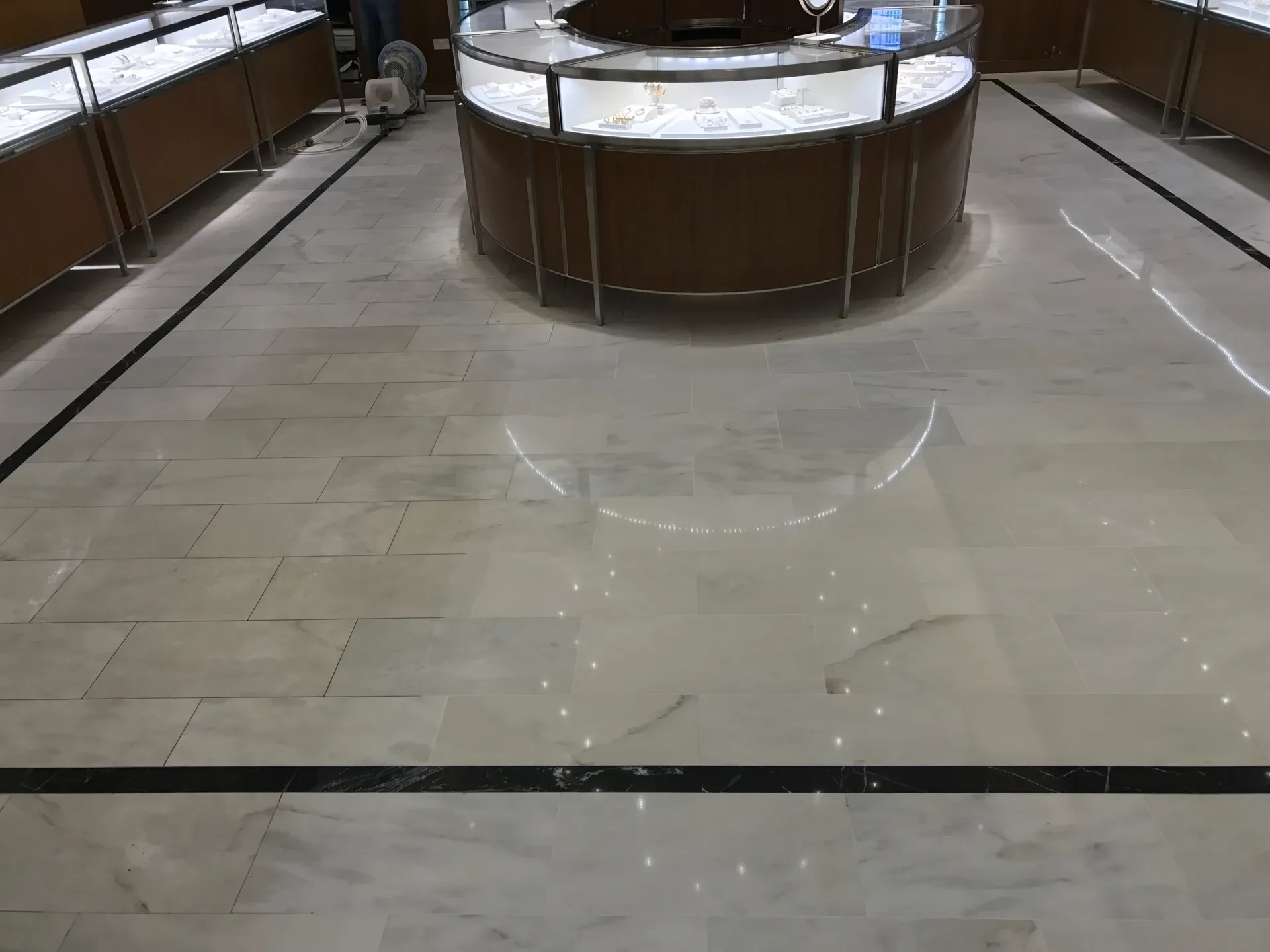 White marble jewellery-store floor with a finished polished surface