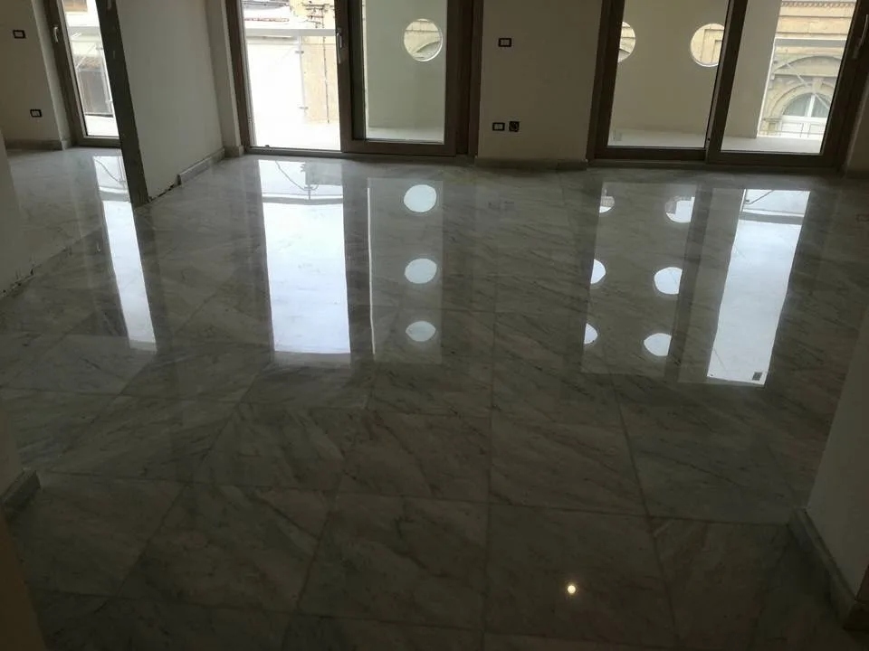 Grey-veined marble room floor after grinding and high polishing