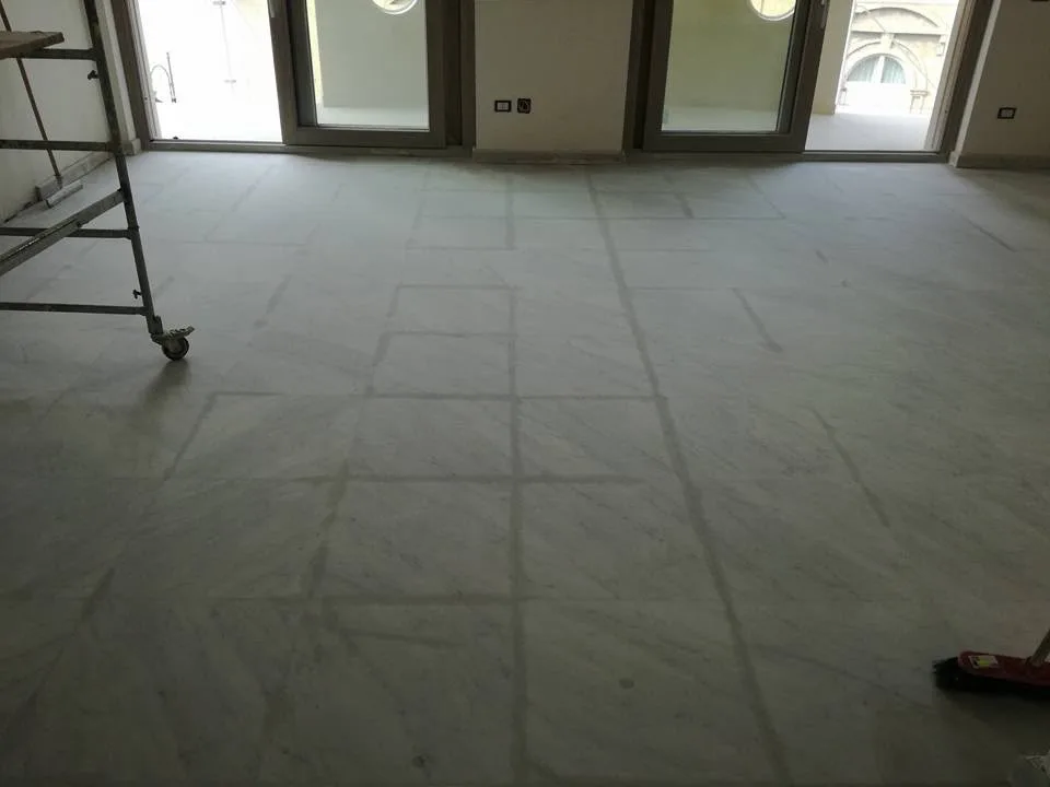 Grey-veined marble room floor before grinding and high polishing